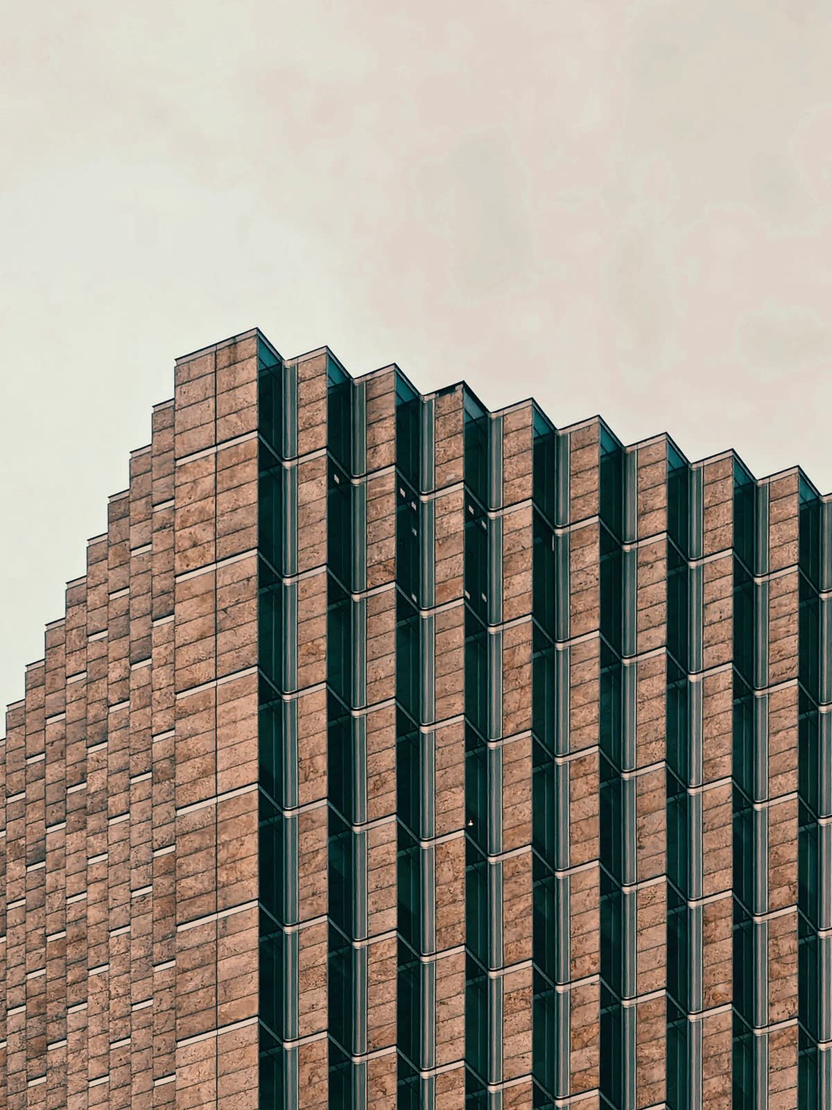 A stone facade of repeating vertical bays